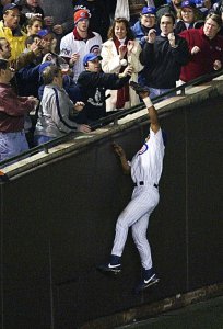 Fans interfere with catch by Alou